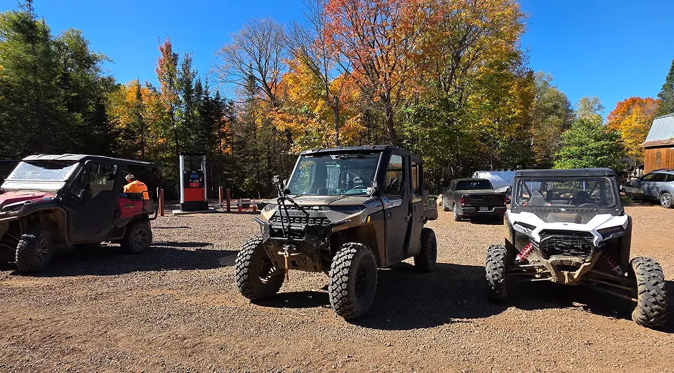 Off-road vehicles in autumn forest setting