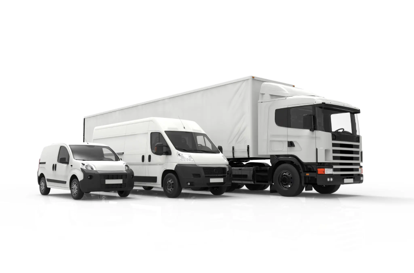 A lineup of three white commercial vehicles parked side by side.